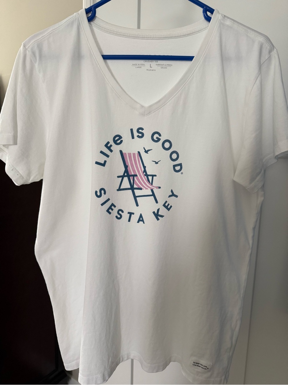 Life Is Good White V‑Neck Tee with Navy & Pink Beach Chair Graphic